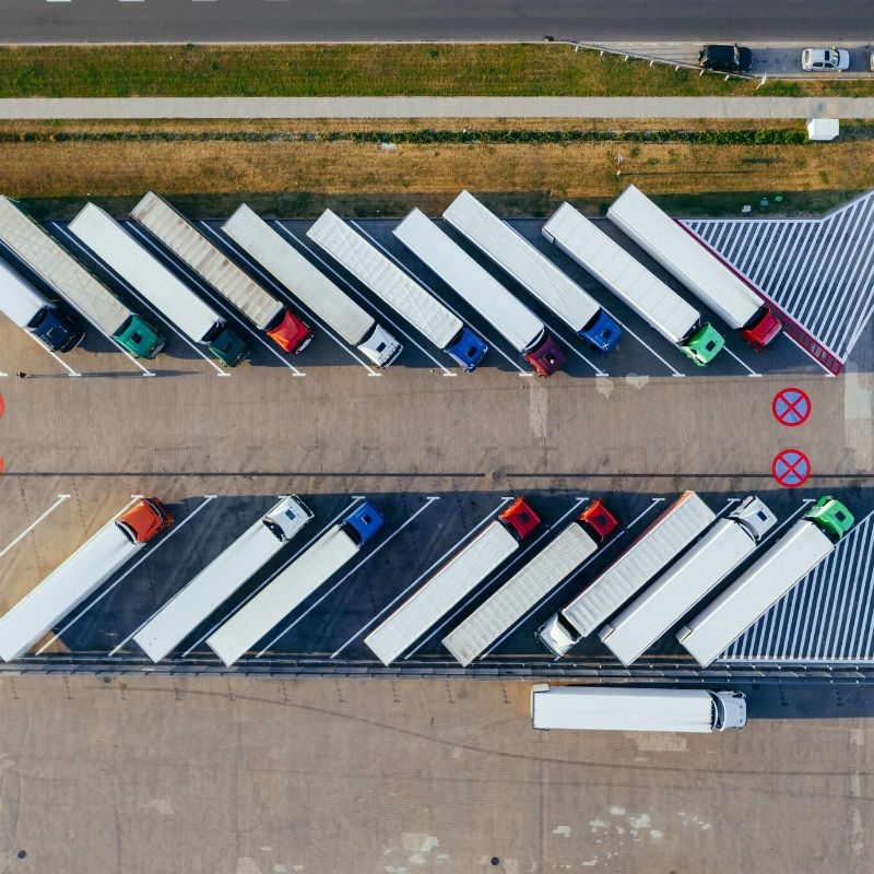Supply chain lorries in a row from above